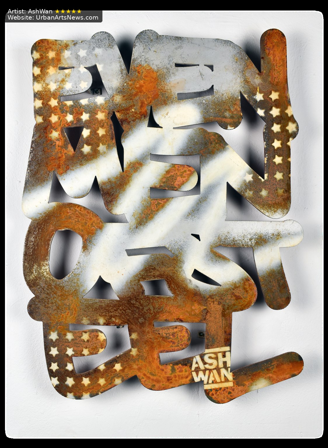 A layered AshWan letter sculpture combining black, silver and distressed gold surfaces.