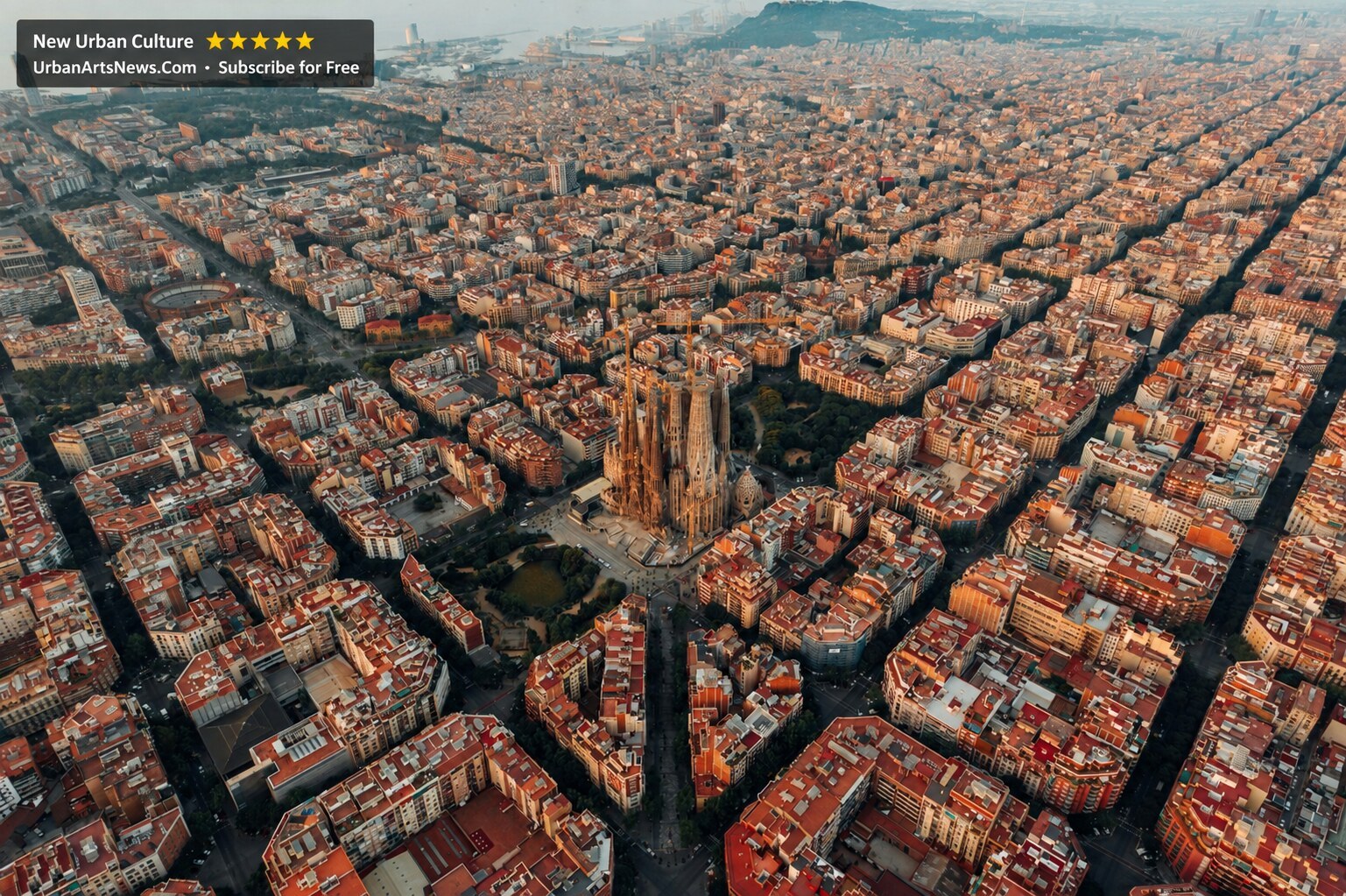 Aerial Barcelona cityscape with the Sagrada Família and Urban Arts News branding