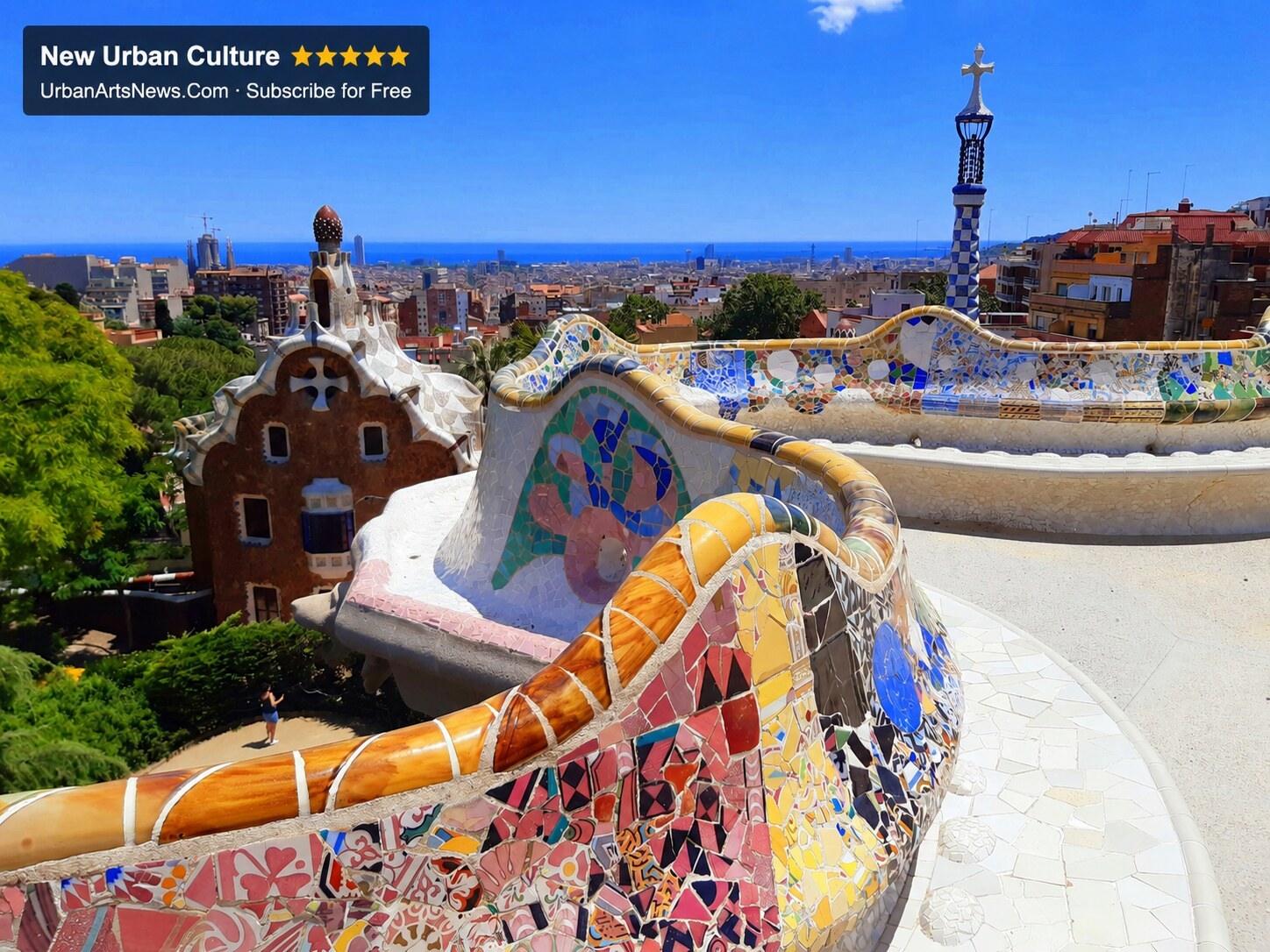 Colourful Park Güell mosaic architecture with Barcelona and Urban Arts News branding