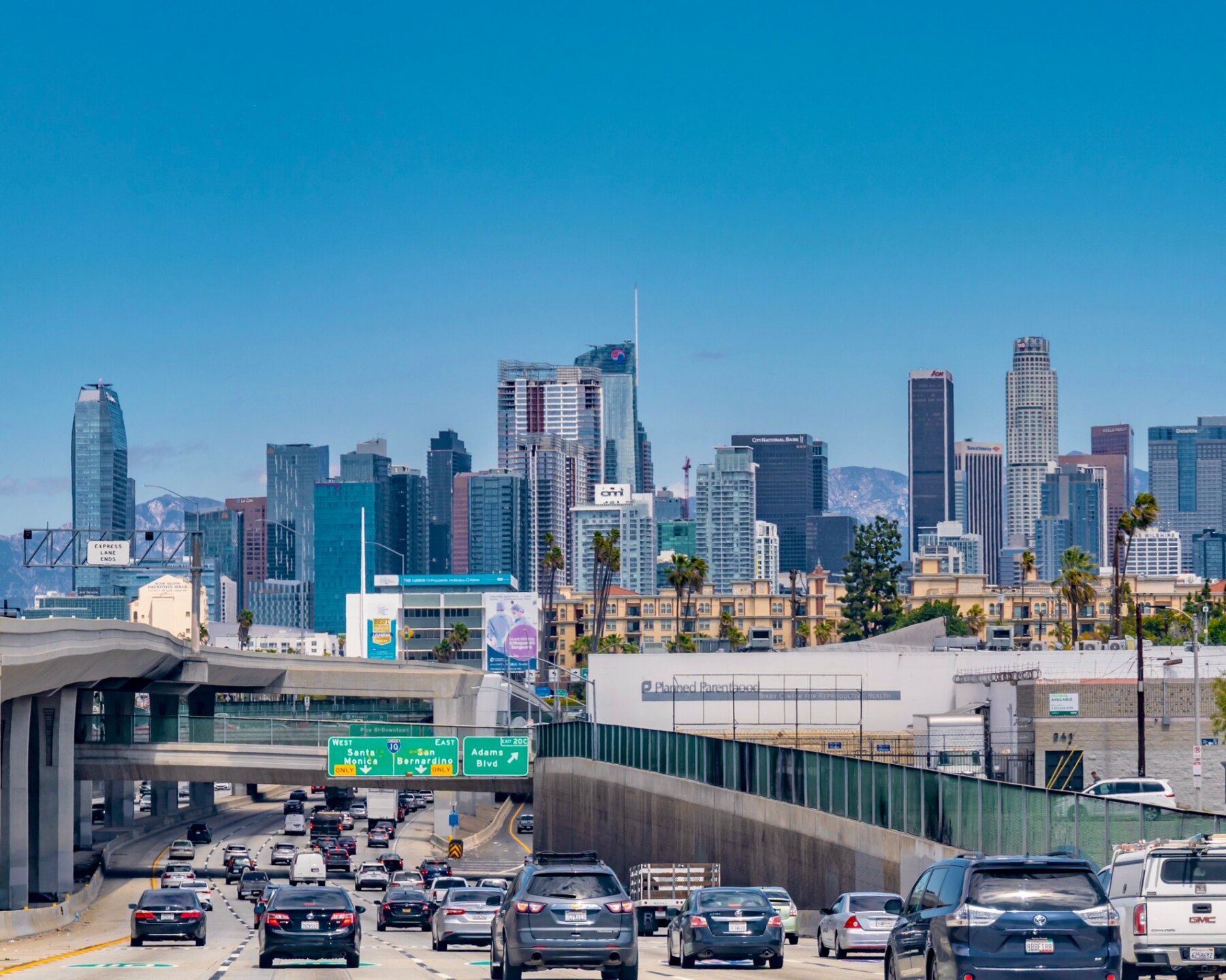 Downtown Los Angeles skyline behind a busy freeway