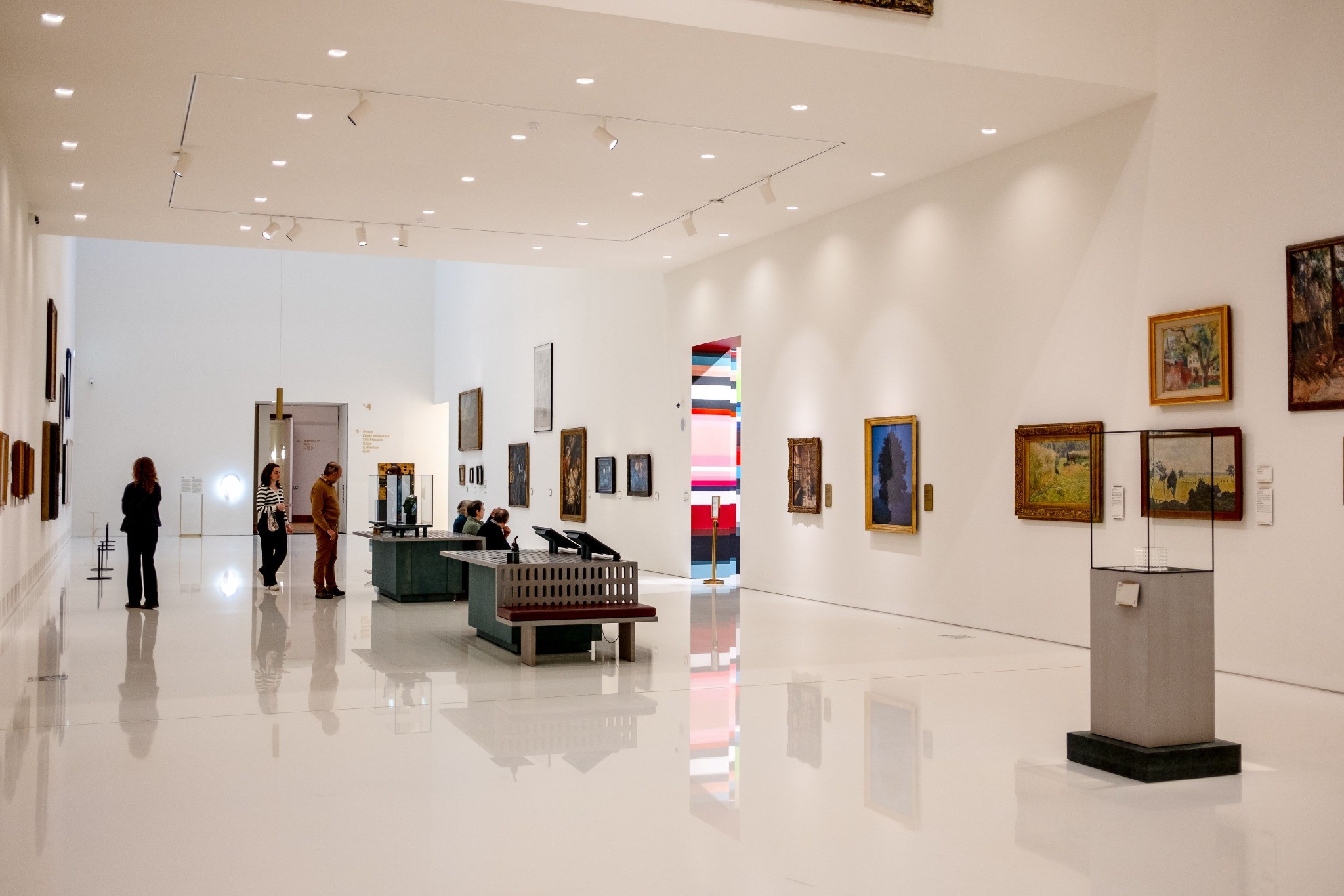 Modern urban art gallery displaying paintings sculpture and installation